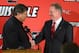 Louisville AD Tom Jurich (left) and head coach Bobby Petrino (right)