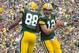 Sep 15, 2013; Green Bay, WI, USA; Green Bay Packers tight end Jermichael Finley (88) and quarterback Aaron Rodgers (12) celebrate a touchdown during the second quarter against the Washington Redskins at Lambeau Field. Mandatory Credit: Jeff Hanisch-USA T