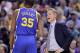INDIANAPOLIS, IN - NOVEMBER 21: Steve Kerr the head coach of the Golden State Warriors talks with Kevin Durant #35 during the game against the Indiana Pacers at Bankers Life Fieldhouse on November 21, 2016 in Indianapolis, Indiana. NOTE TO USER: User