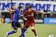 MONTREAL, QC - NOVEMBER 22: Marco Donadel #33 of the Montreal Impact and Will Johnson #7 of the Toronto FC battle for the ball during leg one of the MLS Eastern Conference finals at Olympic Stadium on November 22, 2016 in Montreal, Quebec, Canada. The M