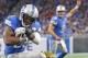 DETROIT, MI - NOVEMBER 20: Theo Riddick #25 of the Detroit Lions runs the ball to the one yard line as Patrick Omameh #77 of the Jacksonville Jaguars makes the stop during the fourth quarter of the game at Ford Field on November 20, 2016 in Detroit, Michi