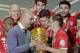 Lahm (right) let Guardiola (left) raise the DFB Pokal in his last game in charge.