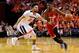 CHARLOTTESVILLE, VA - NOVEMBER 30: JaQuan Lyle #13 of the Ohio State Buckeyes drives against London Perrantes #32 of the Virginia Cavaliers in the first half during a game at John Paul Jones Arena on November 30, 2016 in Charlottesville, Virginia. (Photo