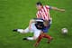 Antonio Lopez lifted the Europa League as Atletico captain.