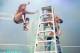 Daniel Bryan leaps at Justin Gabriel during a Money in the Bank ladder match.