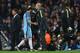 Pep Guardiola gives Ilkay Gundogan a sympathetic pat as the midfielder departs injured.
