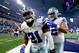 ARLINGTON, TX - DECEMBER 26: Ezekiel Elliott #21 of the Dallas Cowboys celebrates with teammate Travis Frederick #72 after Elliott scored on a touchdown run against the Detroit Lions during the first half at AT&T Stadium on December 26, 2016 in Arlington
