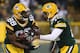GREEN BAY, WI - DECEMBER 11: Aaron Rodgers #12 of the Green Bay Packers hands the ball off to Ty Montgomery #88 during the first half of a game against the Seattle Seahawks at Lambeau Field on December 11, 2016 in Green Bay, Wisconsin. (Photo by Dylan Bu