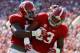 Tomlinson celebrates with Jonathan Allen, and both linemen are likely to be playing on Sundays in the fall.