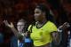 Serena Williams of the US gestures as she speaks after Germany's Angelique Kerber's victory in their women's singles final match on day thirteen of the 2016 Australian Open tennis tournament in Melbourne on January 30, 2016. AFP PHOTO / PAUL CROCK -- IMAG