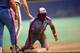 PITTSBURGH - CIRCA 1987: Outfielder Tim Raines #30 of the Montreal Expos looks up after sliding back to first base during a game against the Pittsburgh Pirates at Three Rivers Stadium circa 1987 in Pittsburgh, Pennsylvania. (Photo by George Gojkovich/Get