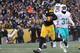 PITTSBURGH, PA - JANUARY 08: Le'Veon Bell #26 of the Pittsburgh Steelers carries the ball into the end zone for a touchdown during the third quarter against the Miami Dolphins in the AFC Wild Card game at Heinz Field on January 8, 2017 in Pittsburgh, Pen
