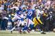 ORCHARD PARK, NY - DECEMBER 11: Le'Veon Bell #26 of the Pittsburgh Steelers carries the ball as Corey Graham #20 and James Ihedigbo #27 of the Buffalo Bills pursue during the game on December 11, 2016 at New Era Field in Orchard Park, New York. Pittsburg