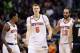 PHOENIX, AZ - DECEMBER 13: Kristaps Porzingis #6 of the New York Knicks walks back to the bench with Brandon Jennings #3 and Joakim Noah #13 after a confrontation with Marquese Chriss #0 (not pictured) of the Phoenix Suns during the second half of the