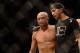 LAS VEGAS, NV - JULY 06: (L-R) BJ Penn walks out of the Octagon with his boxing coach Jason Parillo after being defeated by Frankie Edgar in their featherweight fight during the Ultimate Fighter Finale inside the Mandalay Bay Events Center on July 6, 201