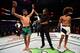 SALT LAKE CITY, UT - AUGUST 06: (L-R) Yair Rodriguez of Mexico celebrates his victory over Alex Caceres after their featherweight bout during the UFC Fight Night event at Vivint Smart Home Arena on August 6, 2016 in Salt Lake City, Utah. (Photo by Jeff B