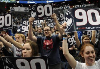 UConn fans celebrate their team's record-tying win on Tuesday.