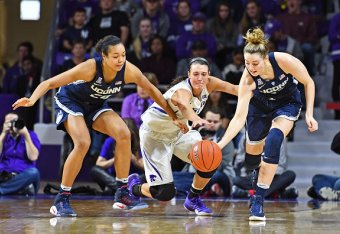 MANHATTAN, KS - DECEMBER 11:  Forward Kaylee Page #1 of the Kansas State Wildcats reaches for a loose ball with players Katie Samuelson #33 and Napheesa Collier #24 of the Connecticut Huskies during the second half on December 11, 2016 at Bramlage Coliseu