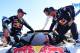 (from L to R) Peugeot's co-driver Jean Paul Cottret of France, team manager Bruno Famin and driver Stephane Peterhansel get to the top of their car to celebrate their victory at the end of the Stage 12 of the Dakar 2017 between Rio Cuarto and Buenos Aires