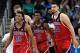LOS ANGELES, CA - JANUARY 21: Kobi Simmons #2 of the Arizona Wildcats is congratulated by his teammates Dusan Ristic #14 and Allonzo Trier #35 after he scored a basket against UCLA during the second half of the game at Pauley Pavilion on January 21, 2017