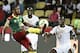 Cameroon's midfielder Arnaud Sutchuin-Djoum (L) challenges Senegal's midfielder Idrissa Gana Gueye during the 2017 Africa Cup of Nations quarter-final football match between Senegal and Cameroon in Franceville on January 28, 2017. / AFP / KHALED DESOUKI