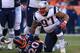 DENVER, CO - DECEMBER 18: Defensive tackle Alan Branch #97 of the New England Patriots stands up after tackling running back Justin Forsett #20 of the Denver Broncos at Sports Authority Field at Mile High on December 18, 2016 in Denver, Colorado. (Photo