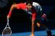 MELBOURNE, AUSTRALIA - JANUARY 22: Grigor Dimitrov of Bulgaria gets back on his feet after a fall in his quarterfinal match against Rafael Nadal of Spain during day 10 of the 2014 Australian Open at Melbourne Park on January 22, 2014 in Melbourne, Austra