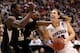 SALT LAKE CITY, UT - MARCH 23: Kelly Olynyk #13 of the Gonzaga Bulldogs drives to the basket against Ehimen Orukpe #21 and Carl Hall #22 of the Wichita State Shockers in the first half during the third round of the 2013 NCAA Men's Basketball Tournament a
