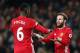 MANCHESTER, ENGLAND - DECEMBER 31: Paul Pogba of Manchester United celebrates with team mate Juan Mata after victory in the Premier League match between Manchester United and Middlesbrough at Old Trafford on December 31, 2016 in Manchester, England. (Ph