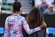 Venus Williams puts her arm around her sister Serena before the start of their match at the 2017 Australian Open.
