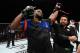 Referee Mario Yamasaki declares Lewis the victor.