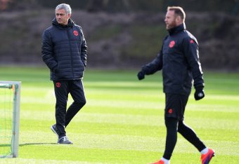 MANCHESTER, ENGLAND - NOVEMBER 23: Jose Mourinho manager of Manchester United and Wayne Rooney look on during a Manchester United training session on the eve of their UEFA Europa League match against Feyenoord at Aon Training Complex on November 23, 2016