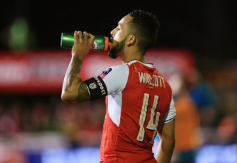 SUTTON, GREATER LONDON - FEBRUARY 20: Theo Walcott of Arsenal has a drink during The Emirates FA Cup Fifth Round match between Sutton United and Arsenal on February 20, 2017 in Sutton, Greater London. (Photo by Catherine Ivill - AMA/Getty Images)