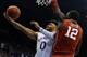 LAWRENCE, KS - FEBRUARY 27: Frank Mason III #0 of the Kansas Jayhawks lays the ball up against Khadeem Lattin #12 of the Oklahoma Sooners in the first half at Allen Fieldhouse on February 27, 2017 in Lawrence, Kansas. (Photo by Ed Zurga/Getty Images)