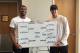 Duke's Matt Jones (left) and Luke Kennard show off a cornhole tournament bracket at head coach Mike Krzyzewski's house.