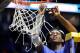 NASHVILLE, TN - MARCH 12: De'Aaron Fox #0 of the Kentucky Wildcats cuts the net after their 82-65 win over the Arkansas Razorbacks in the championship game at the 2017 Men's SEC Basketball Tournament at Bridgestone Arena on March 12, 2017 in Nashville, T