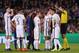 Paris Saint-Germain's Italian midfielder Marco Verratti (C) and teammates argue with referee during the UEFA Champions League round of 16 second leg football match FC Barcelona vs Paris Saint-Germain FC at the Camp Nou stadium in Barcelona on March 8, 201