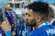 Leicester City's Algerian midfielder Riyad Mahrez kisses the premier league trophy after winning the league and the English Premier League football match between Leicester City and Everton at King Power Stadium in Leicester, central England on May 7, 2016