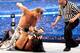 Marty Elias oversees the action as Shawn Michaels pounds on Undertaker.