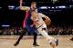 NEW YORK, NY - MARCH 27: Kristaps Porzingis #6 of the New York Knicks heads for the net as Jon Leuer #30 of the Detroit Pistons defends at Madison Square Garden on March 27, 2017 in New York City. NOTE TO USER: User expressly acknowledges and agrees that