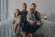 Kyle Johnson with his wife, Susan, and their daughters Adelyn (left) and Channing.