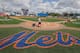 Members of the grounds crew prepare the field before a spring training game on February 25, 2017, in Port St. Lucie, Florida.