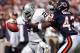 CHICAGO - OCTOBER 5: Running back Charlie Garner #25 of the Oakland Raiders fights off a tackle attempt by safety Mike Green #43 of the Chicago Bears at Soldier Field on October 5, 2003 in Chicago, Illinois. The Bears defeated the Raiders 24-21. (Photo b