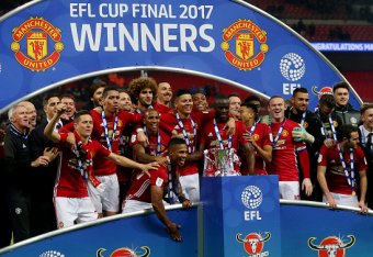 LONDON, ENGLAND - FEBRUARY 26: Manchester United celebrate with the trophy during the EFL Cup Final match between Manchester United and Southampton at Wembley Stadium on February 26, 2017 in London, England. (Photo by Catherine Ivill - AMA/Getty Images)