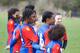 Remmi Gardner (centre) and Lydia Simms (No. 16) listen to the pre-match team talk