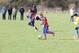 Jessica Ellum runs through on the ball, with Angel Johnson in the background