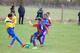 Lily Edwards challenges for a tackle, with Laila Malcolm in support