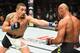 KANSAS CITY, MO - APRIL 15: (L-R) Robert Whittaker of New Zealand punches Jacare Souza of Brazil in their middleweight fight during the UFC Fight Night event at Sprint Center on April 15, 2017 in Kansas City, Missouri. (Photo by Josh Hedges/Zuffa LLC/Zuf