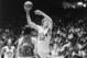 UCLA's Bill Walton goes up for a shot against Maryland's Tom McMillen and Len Elmore at Pauley Pavilion in Los Angeles on December 1, 1973. The Bruins won 65-64.