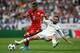 MADRID, SPAIN - APRIL 18: Douglas Costa of Bayern Muenchen and Dani Carvajal of Real Madrid compete for th e ball during the UEFA Champions League Quarter Final second leg match between Real Madrid CF and FC Bayern Muenchen at Estadio Santiago Bernabeu on